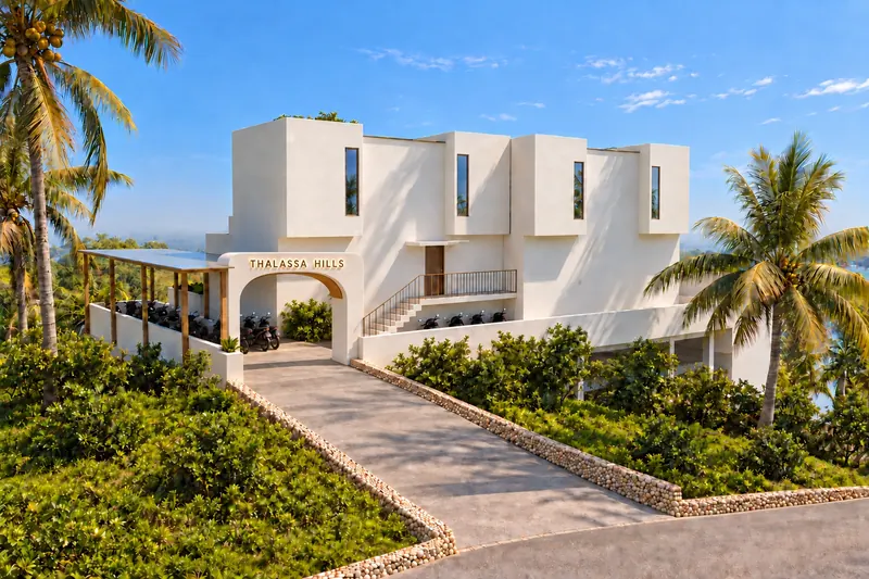 Entrada de Thalassa Hills con el nombre sobre el arco