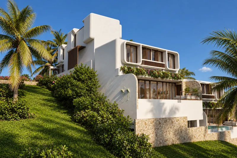 Villa lateral de Thalassa Hills sobre la ladera verde, entre palmeras